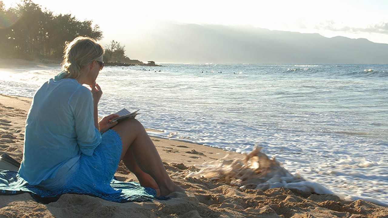 Woman Sitting on Beach