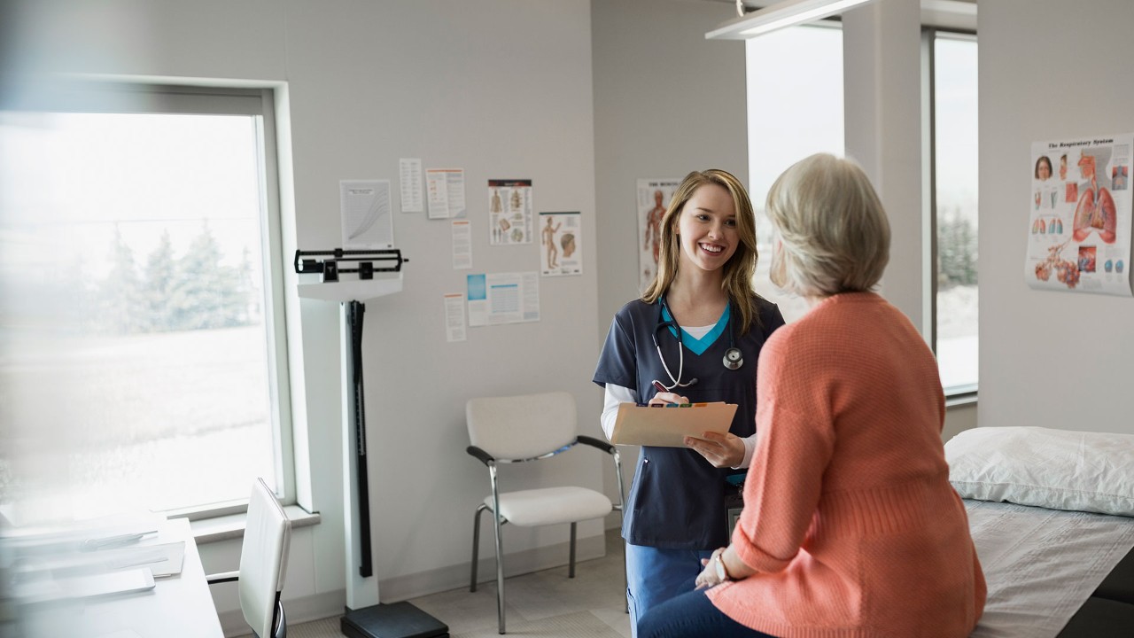 nurse talking to a patient in a doctor's office