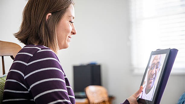 Woman talking to her doctor using video chat