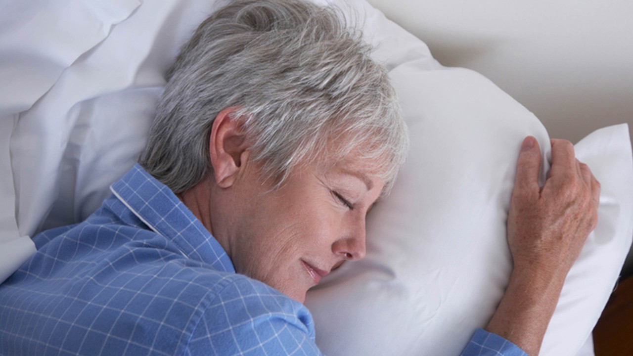 woman smiling while sleeping