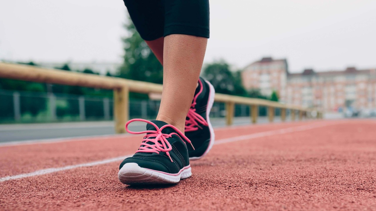 close up of woman's walking on a track