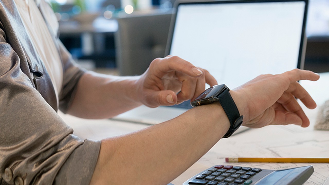 man checking his smart watch