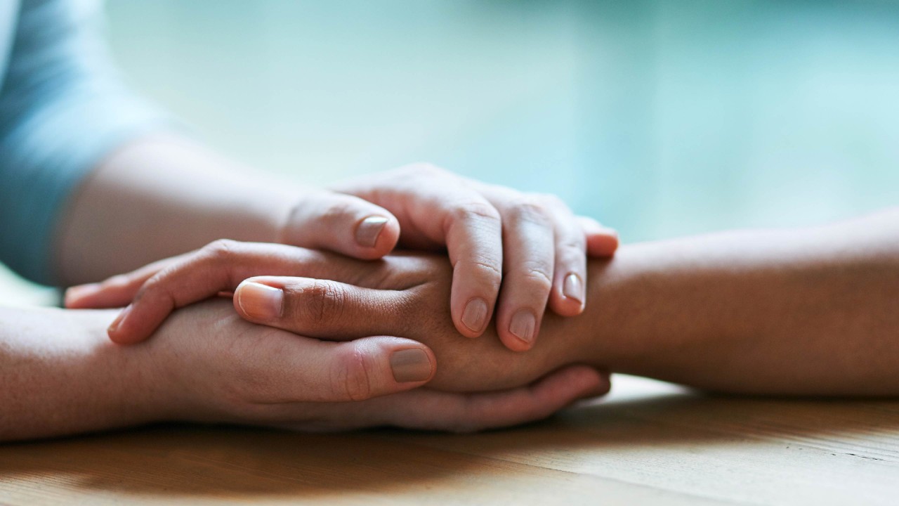 close up of people holding hands