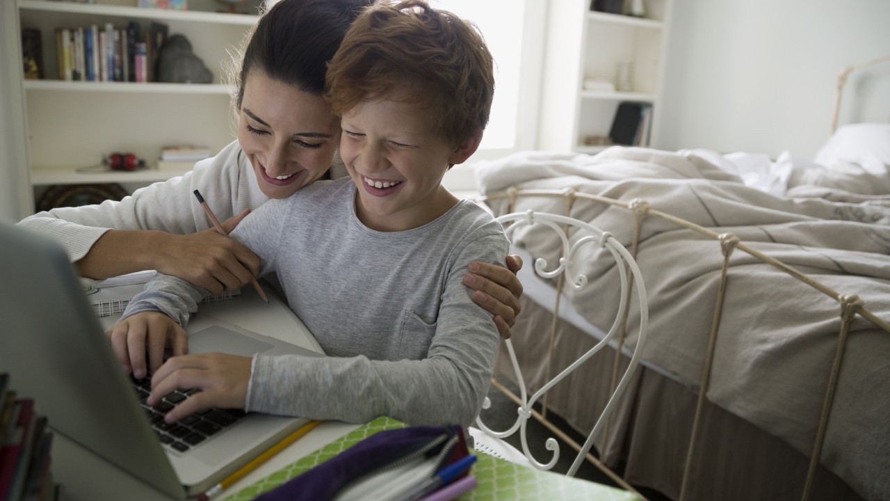 mom helping her son do homework