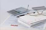 Financial Paperwork and Eyeglasses