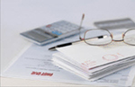Financial Paperwork and Eyeglasses