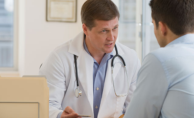 doctor talking to a patient across a table