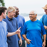 group of men talking together on a walk