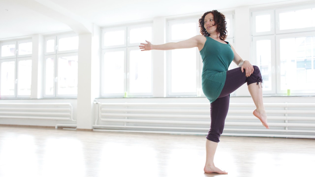 woman doing pilates in a studio