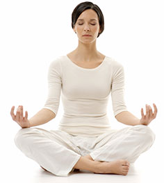woman meditating with her eyes closed