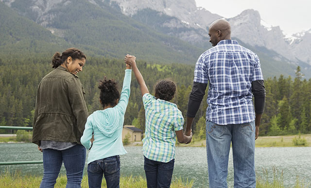 family looking at the mountains together