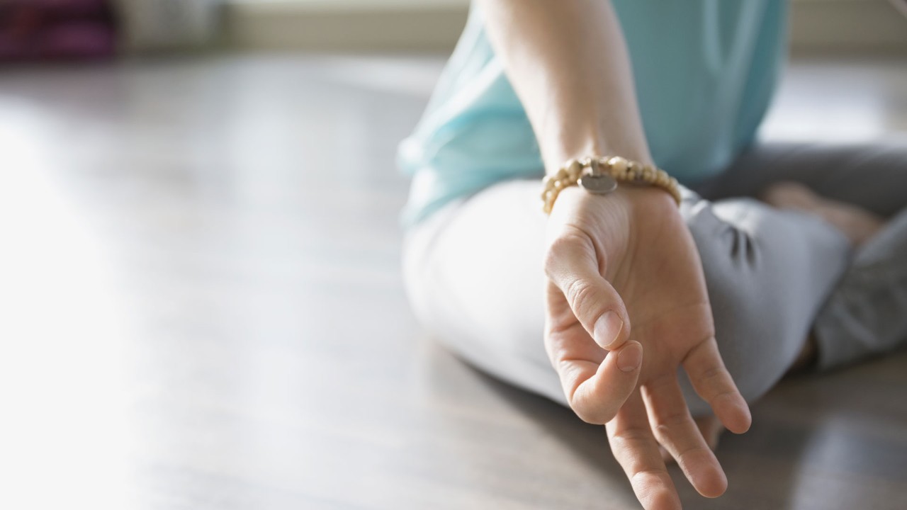 close up of woman doing yoga