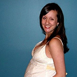 pregnant woman smiling at camera
