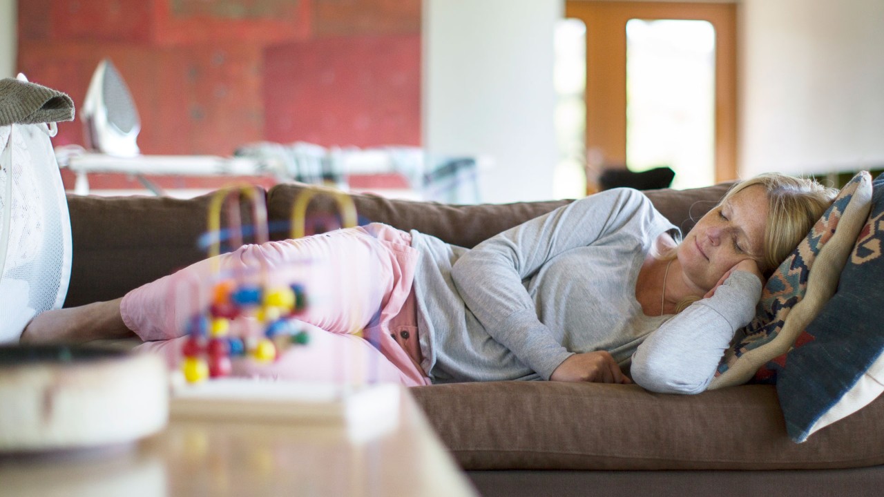 woman taking a nap on a couch